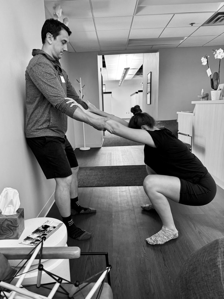 Partner supported squat